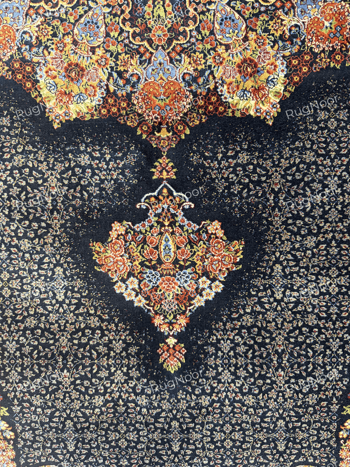 Close-up of the sky blue corner motif and dense traditional pattern on the navy field by RugNoor