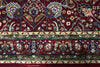 Close-up of Firman Persian rug forest green border stripe showing layered floral motifs in green, gold and ivory