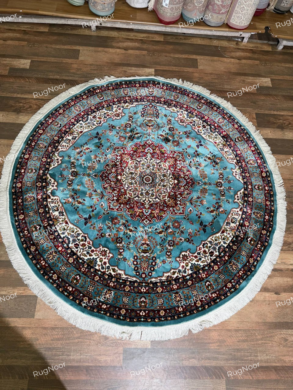 Complete view of Fayruz round traditional rug with turquoise field, multicolour floral medallion and layered ornamental borders - RugNoor