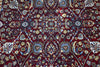 Firman Persian rug centre — dense all-over floral arabesque in deep crimson with blue, green, gold and ivory accents