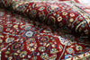 Firman Persian rug folded showing completely washable acrylic wool pile and rich crimson floral pattern detail