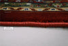 Side edge of Firman Persian rug showing durable woven backing and reinforced bound edge construction