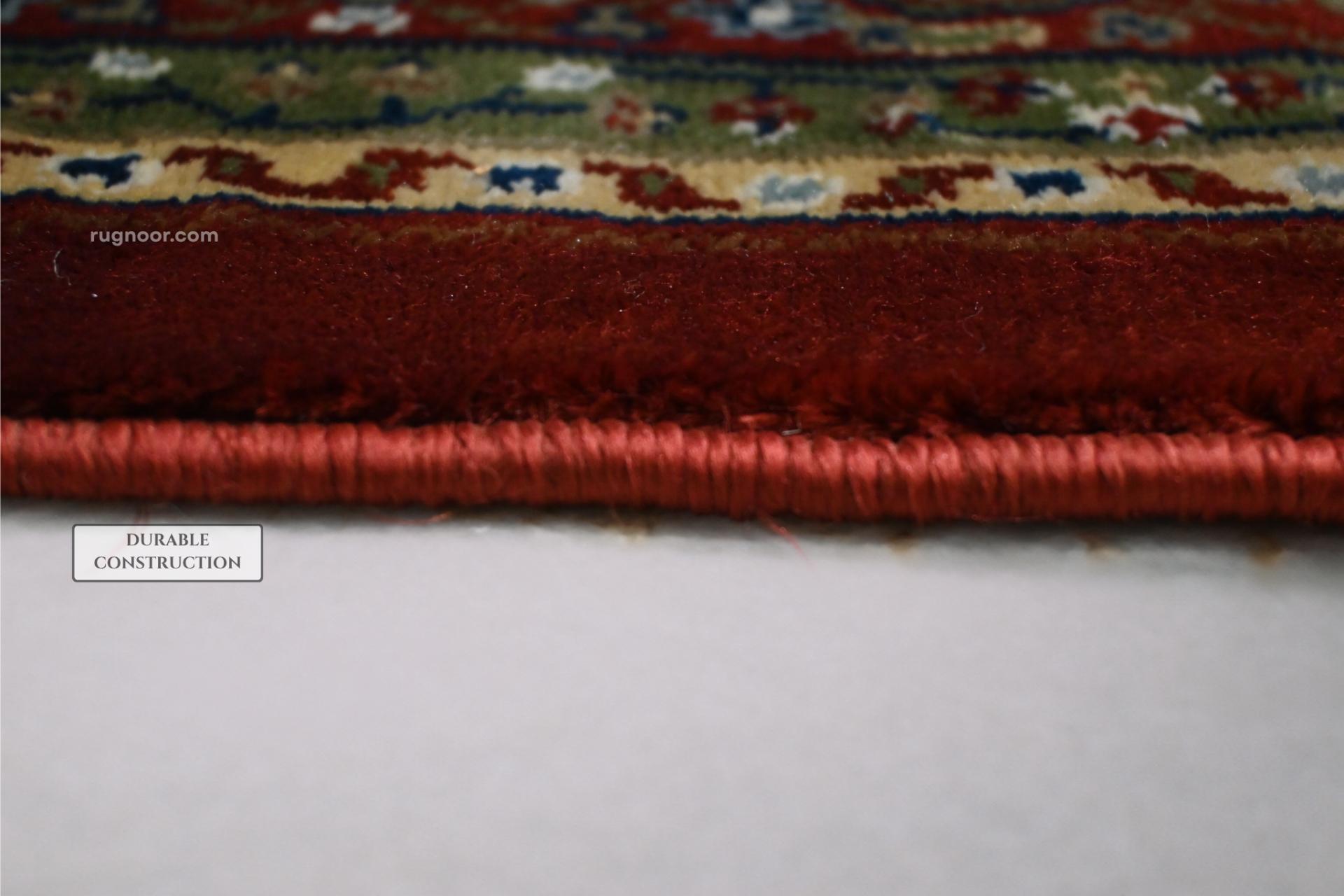 Side edge of Firman Persian rug showing durable woven backing and reinforced bound edge construction