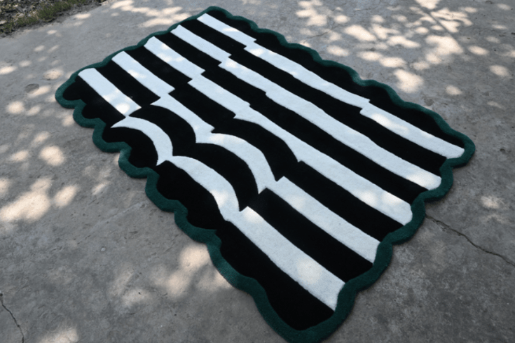 Black and white striped rug with scalloped green border – hand-tufted carpet, RugNoor