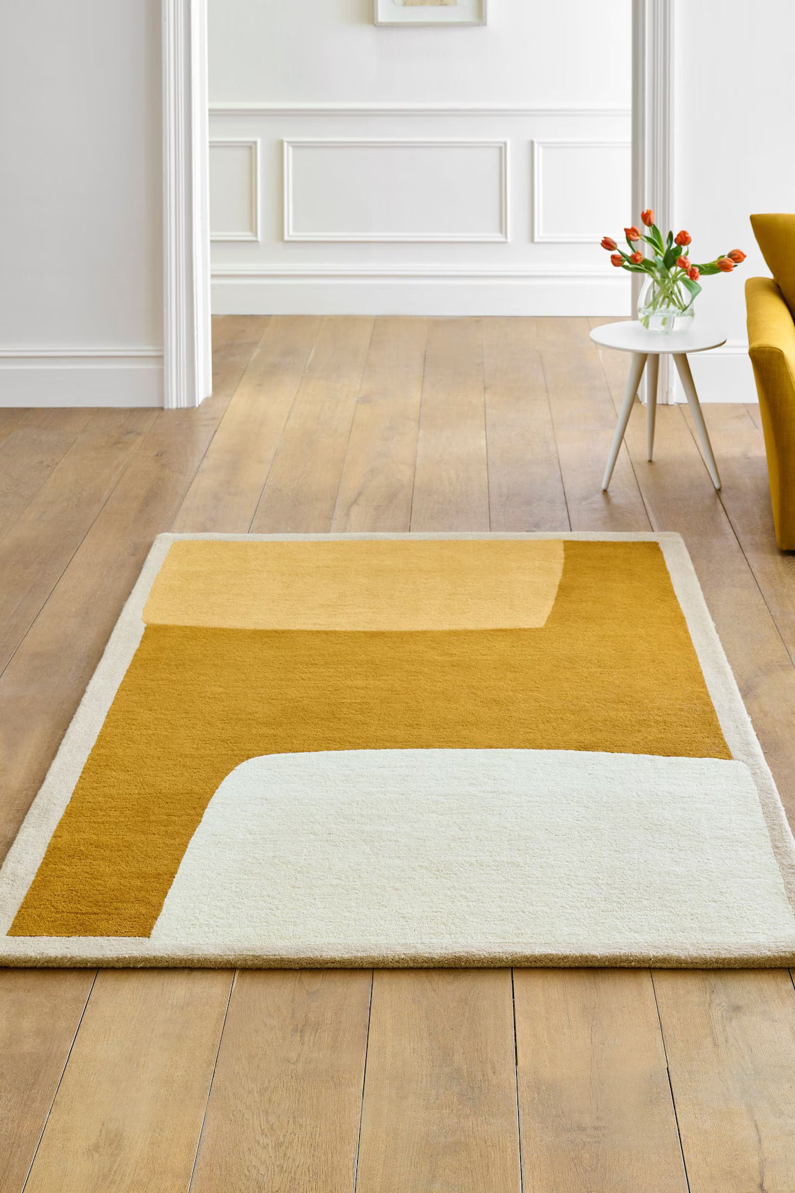Hand tufted mustard wool rug for bedroom or living room spaces