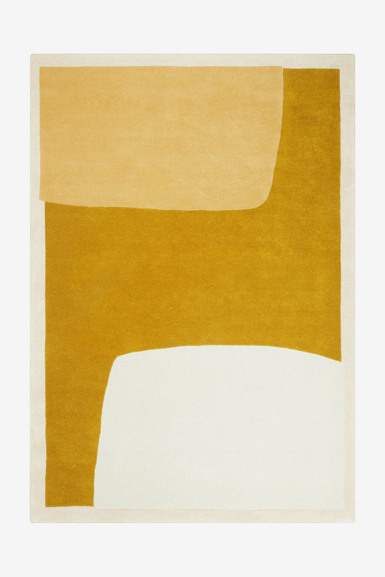 Hand tufted mustard wool rug for bedroom or living room spaces
