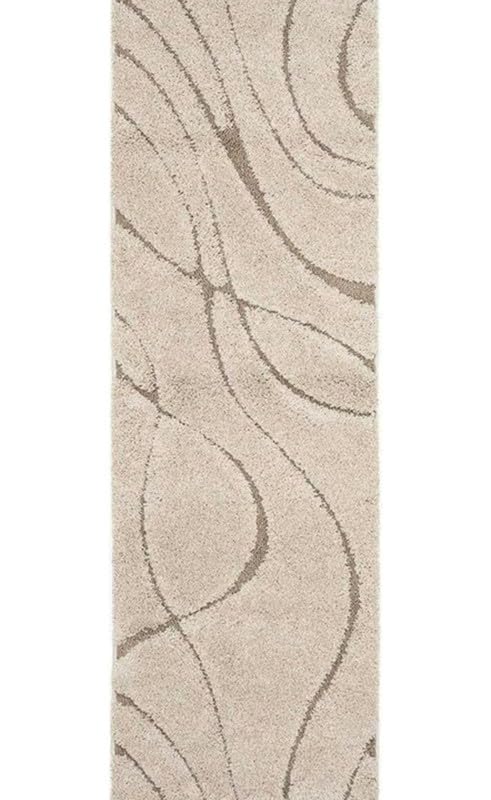 A long rectangular area rug with a light beige base and a darker taupe wavy line pattern, shown flat against a white background.