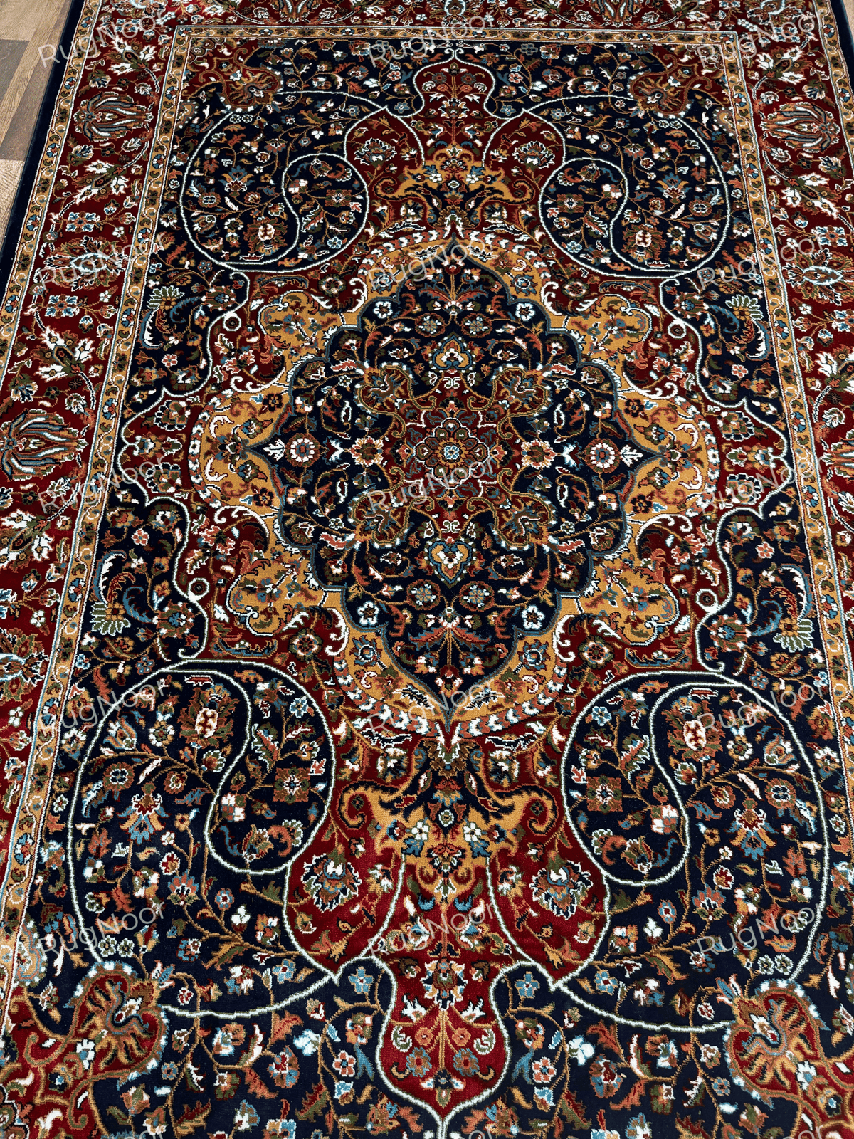 Navy rug with ornate central medallion, gold floral details and red borders - Jouri RugNoor