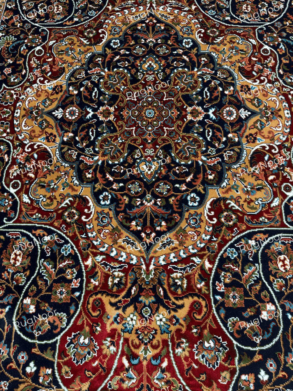 Close-up of Jouri rug's intricate navy, gold, red and ivory floral medallion - RugNoor