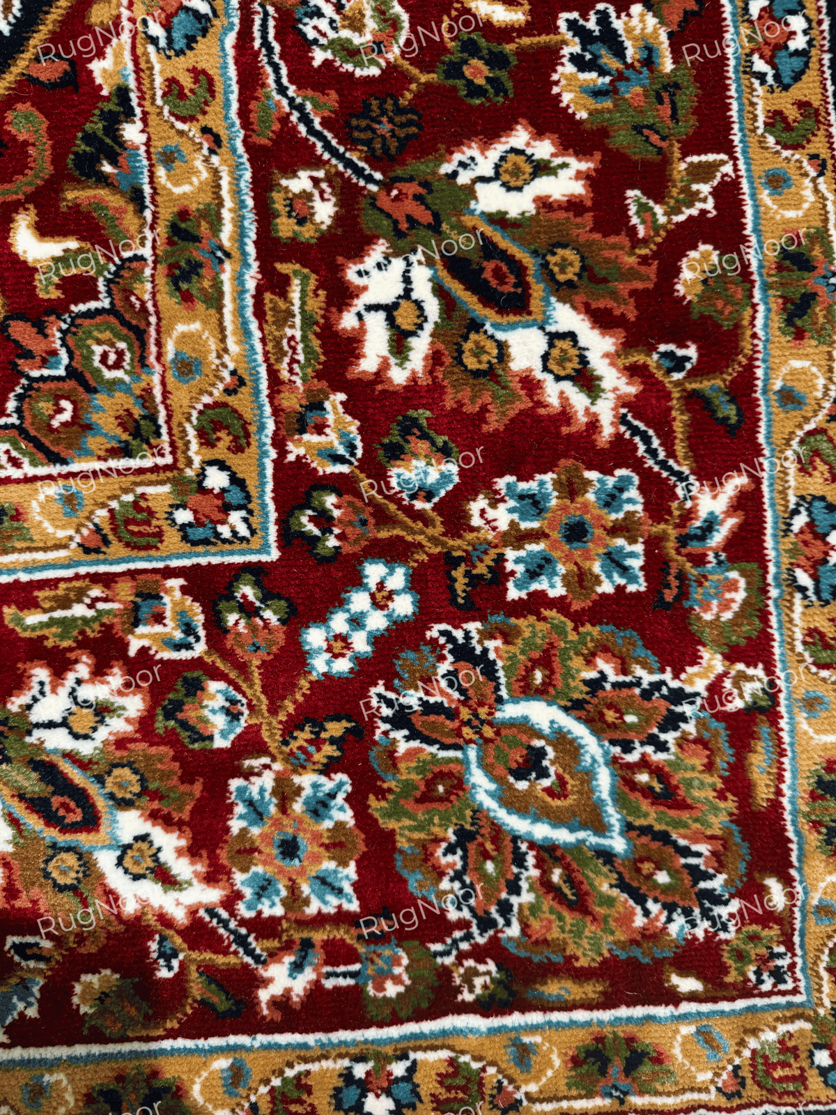 Red floral border with gold, ivory, teal and navy motifs on Jouri rug - RugNoor