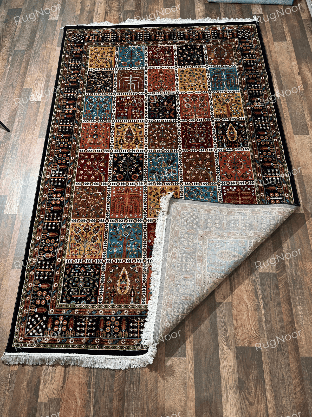 Full view of multicolour patchwork rug with dark ornamental borders - Kashida RugNoor