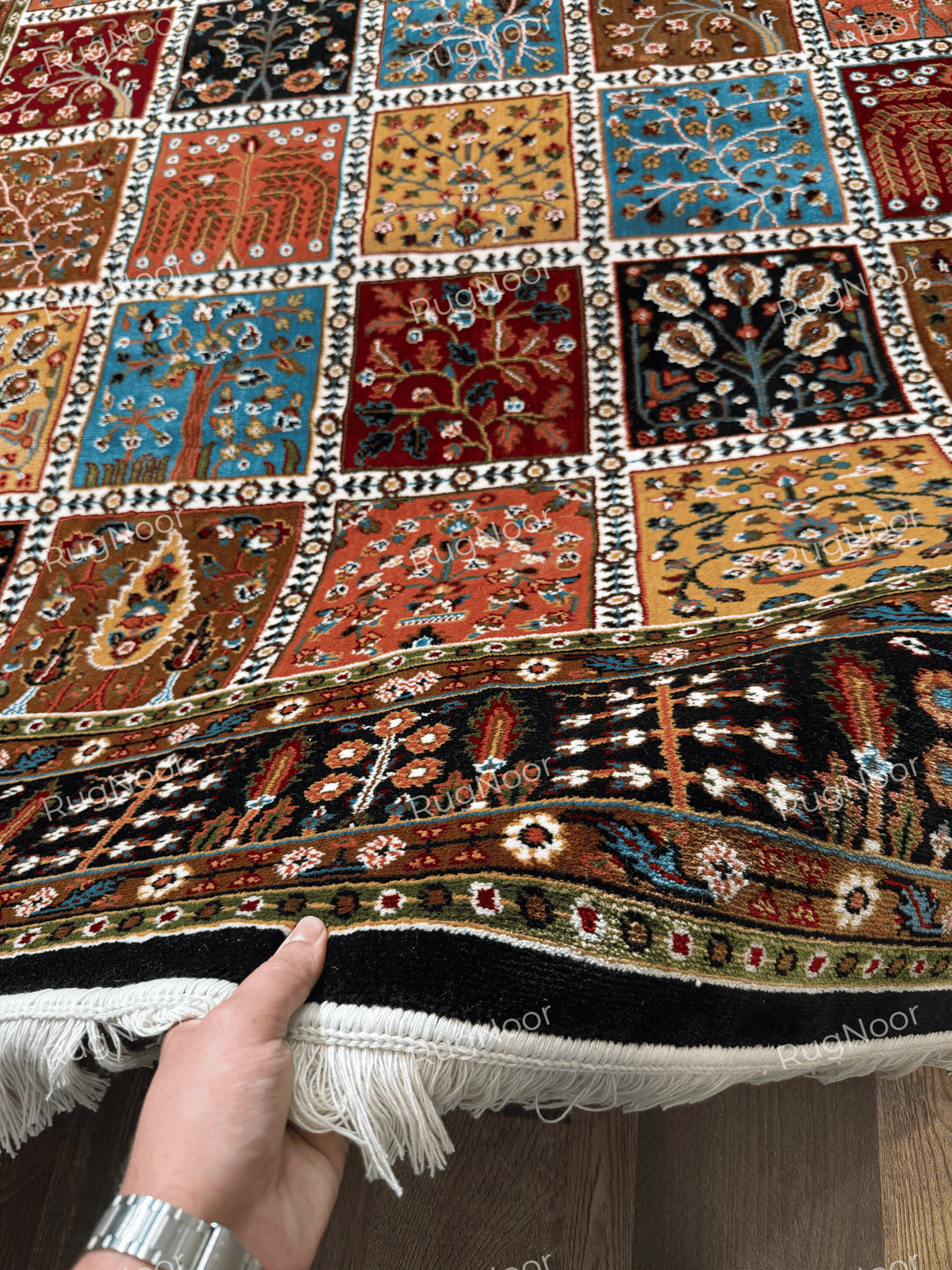 Close-up of colourful floral panels separated by ivory latticework - Kashida RugNoor