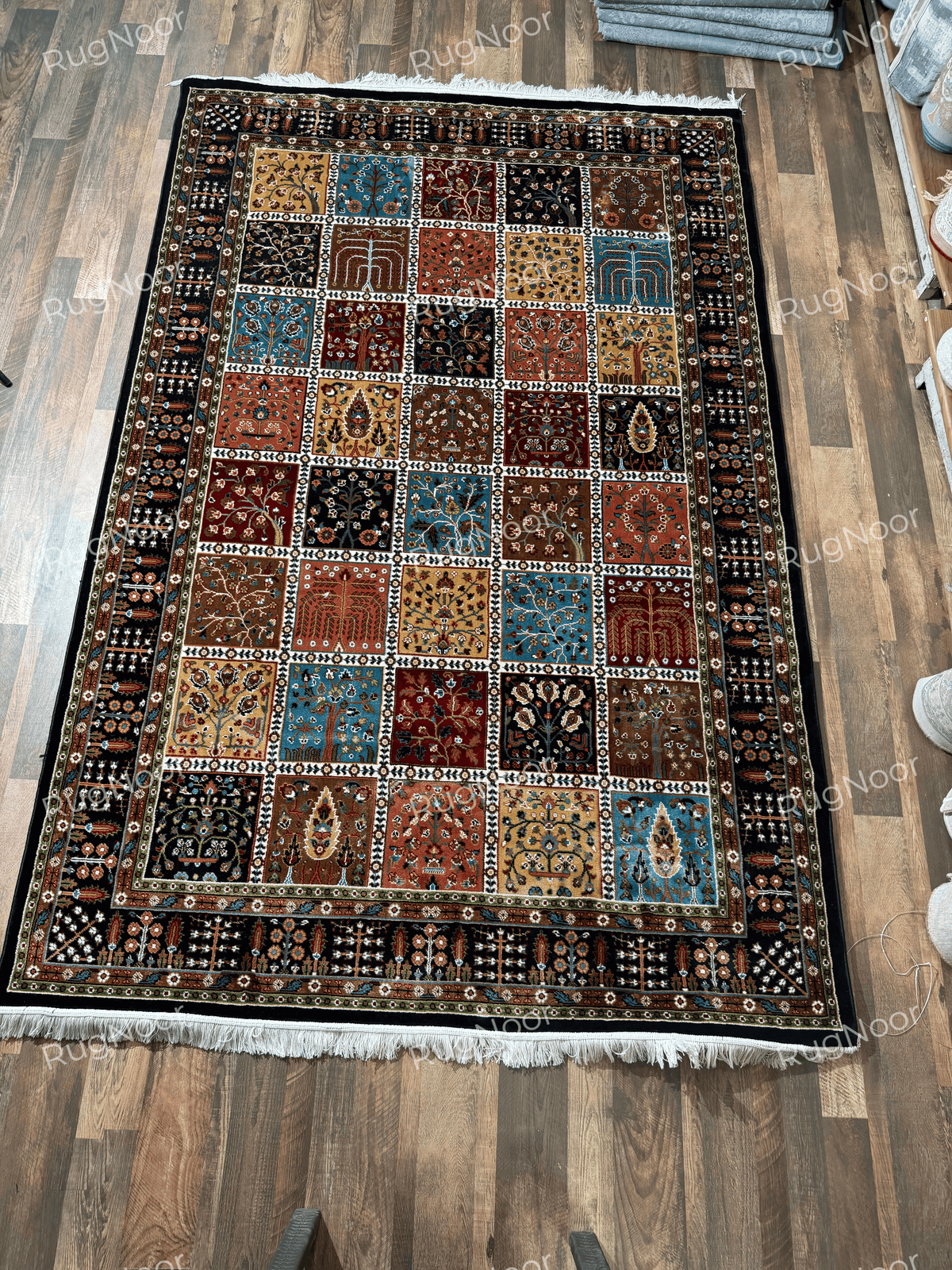 Full view of multicolour patchwork rug with dark ornamental borders - Kashida RugNoor