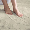 Feet standing on a beige rabbit fur carpet