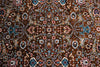 Naqsh Persian rug centre — dense all-over floral arabesque pattern in warm brown, teal, rose and ivory