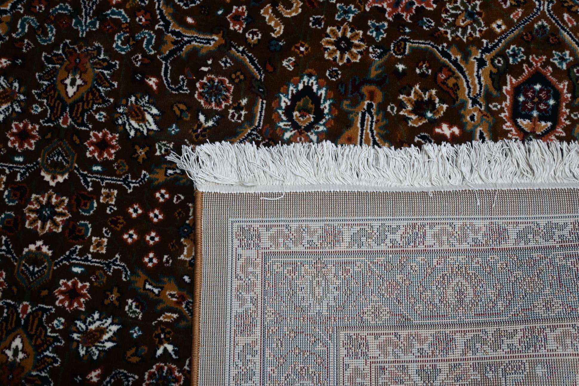 Back of Naqsh Persian rug showing durable woven backing construction and hand-finished ivory cotton fringe