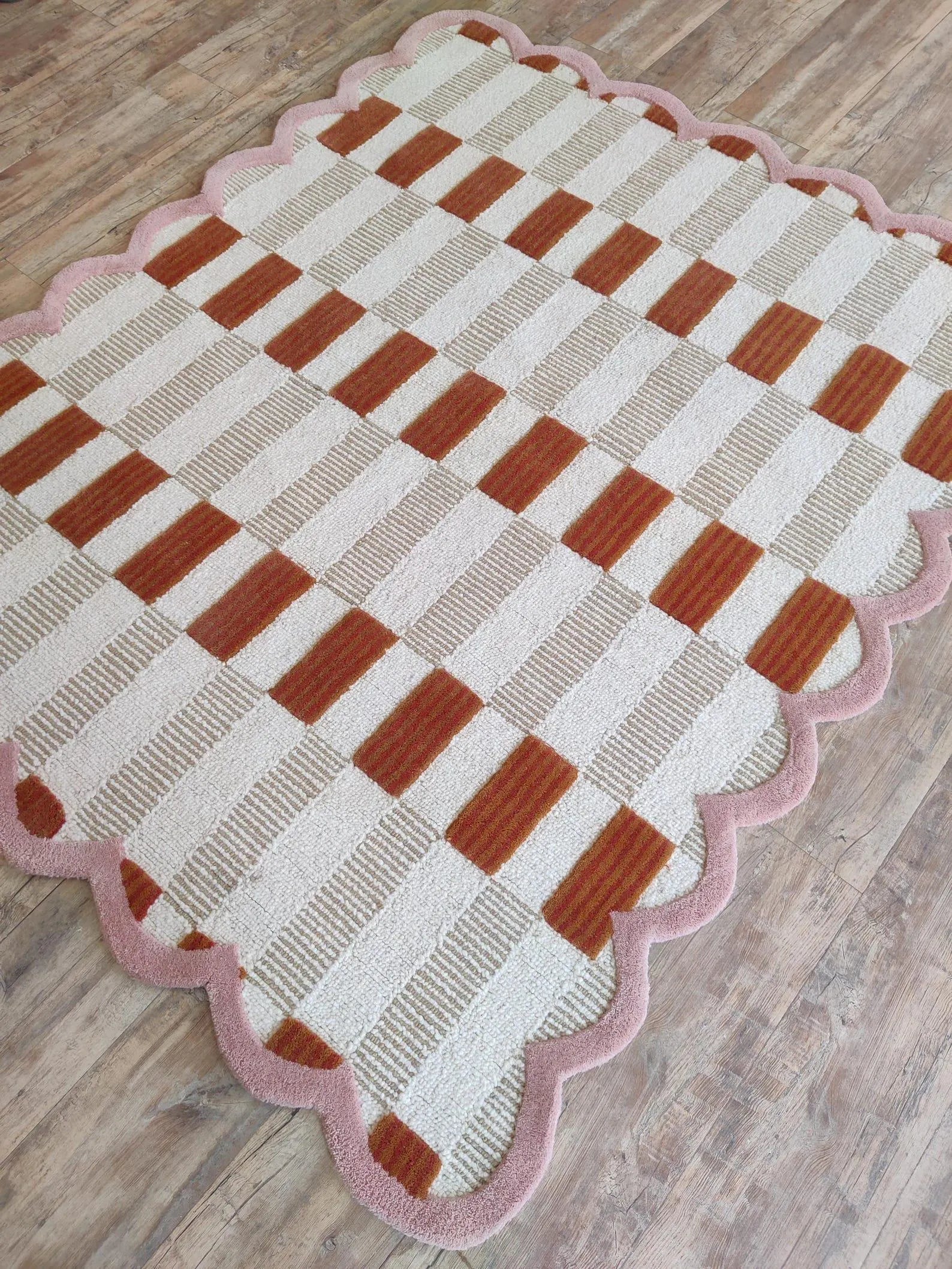 pink scalloped rug carpet