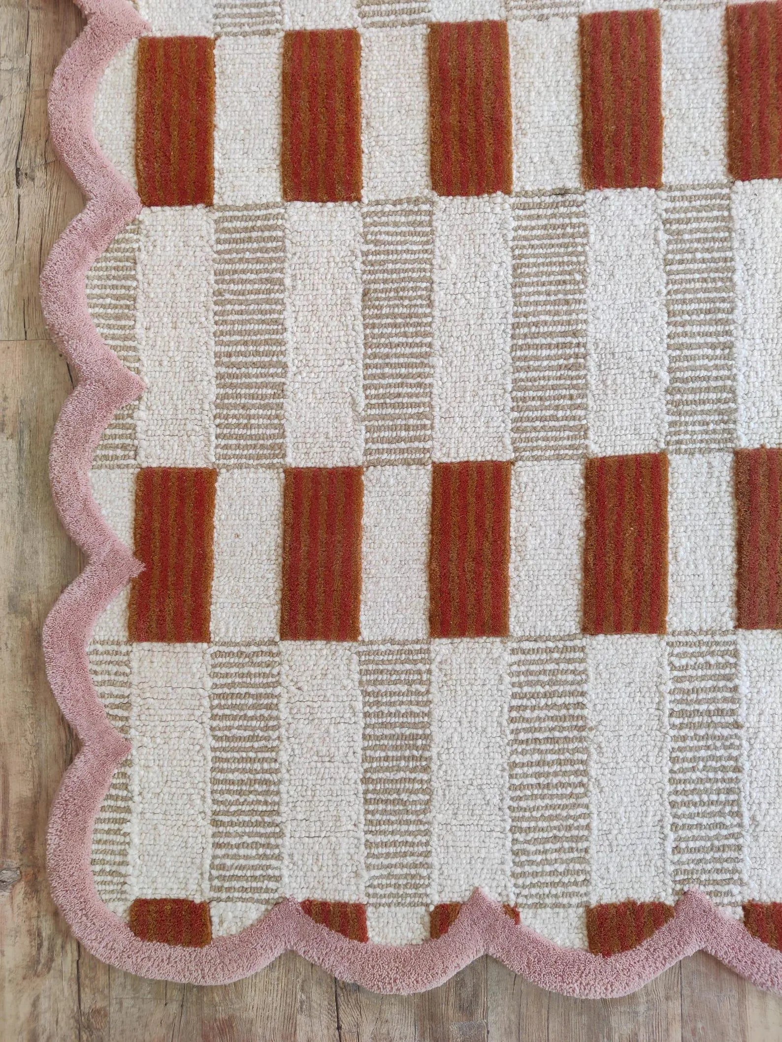 closeup of pink scalloped rug carpet