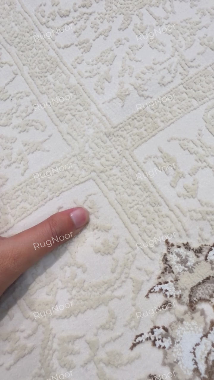 Close-up of the intricate ivory detailing on Parichehr, RugNoor.
Copy alt text