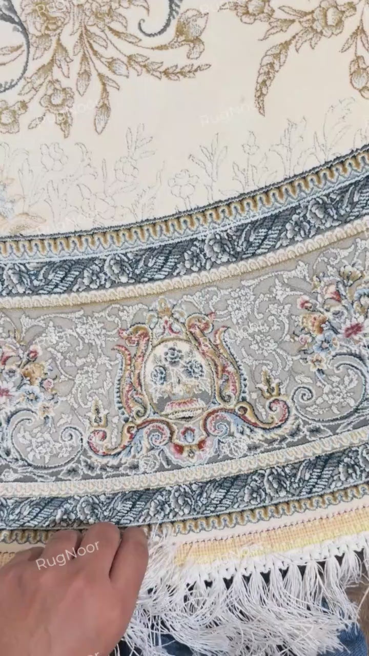 Mahzarin carpet’s curved edge, decorative border, ivory fringe, and underside 