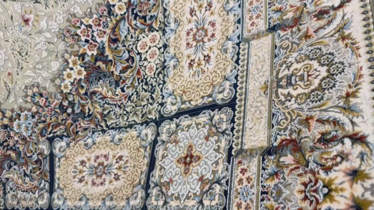 Detailed view of the ivory vine motifs against the muted grey-taupe background of Zanbaq, RugNoor.