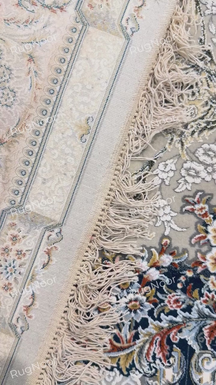 Carpet folded over to show its surface and reverse side, RugNoor.