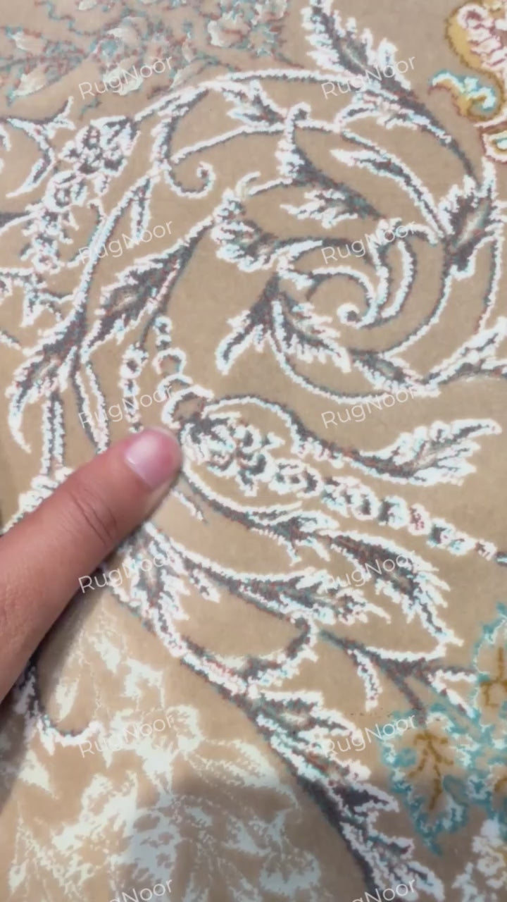 Close-up of Warda's multi-layered border with small floral motifs in ivory, grey, beige and blue, RugNoor.