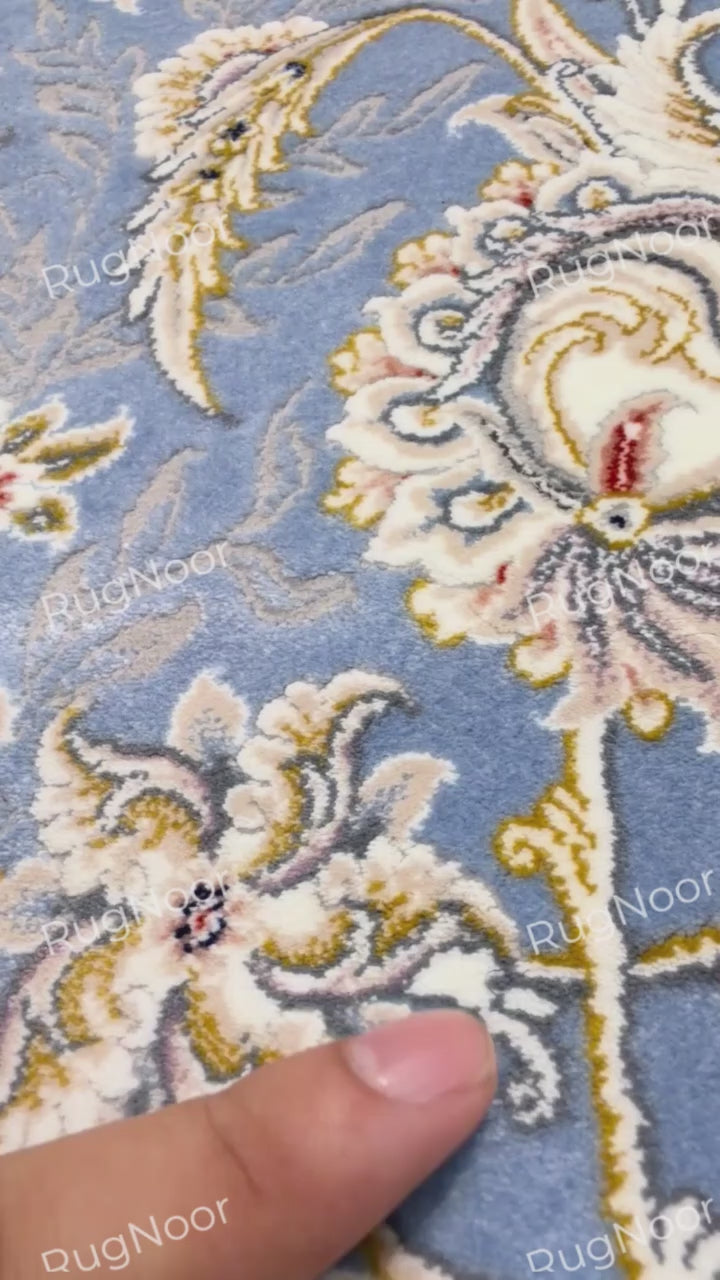 Close-up of Nardine's dusty blue floral field