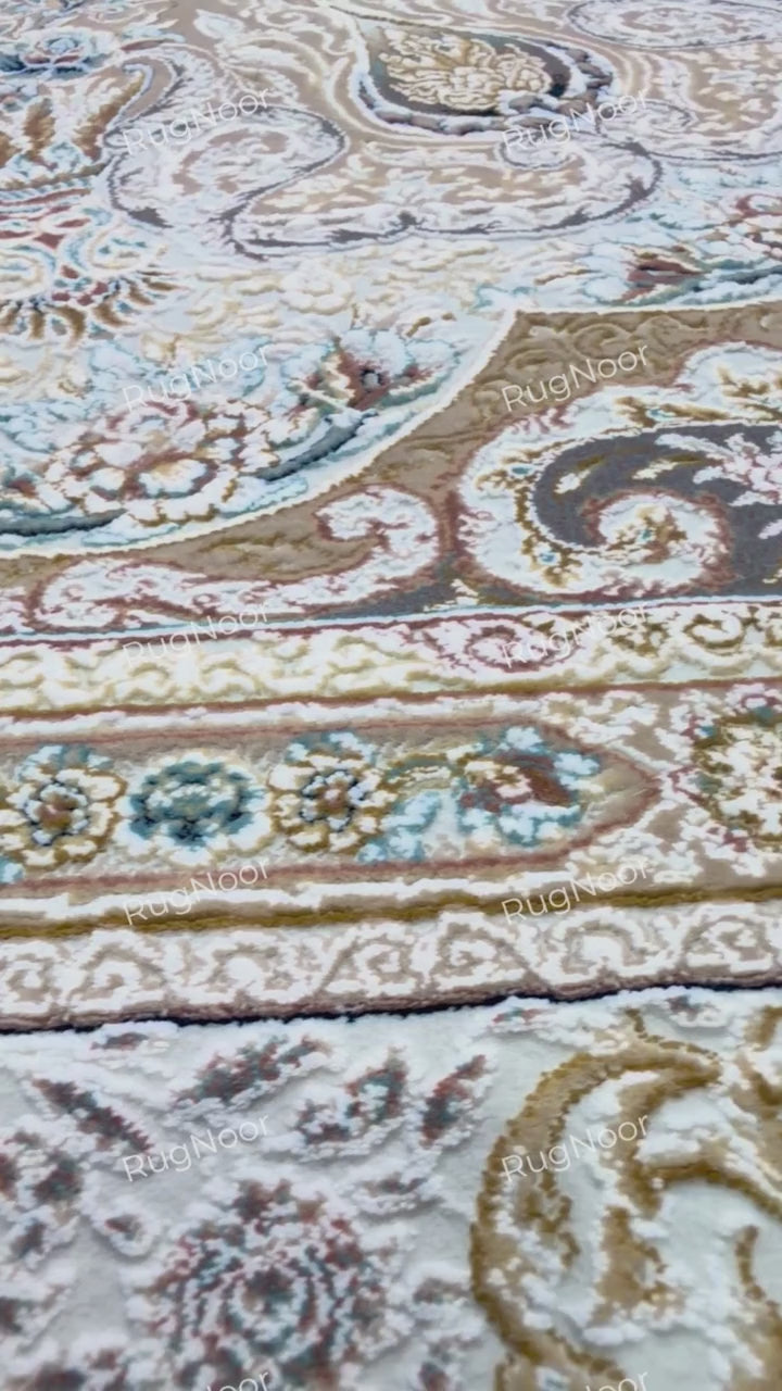 Warda's central medallion and surrounding scrolling floral motifs across the beige carpet field, RugNoor.