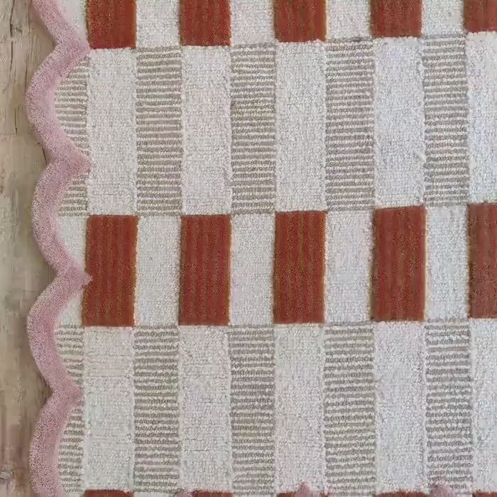 closeup of pink scalloped rug carpet