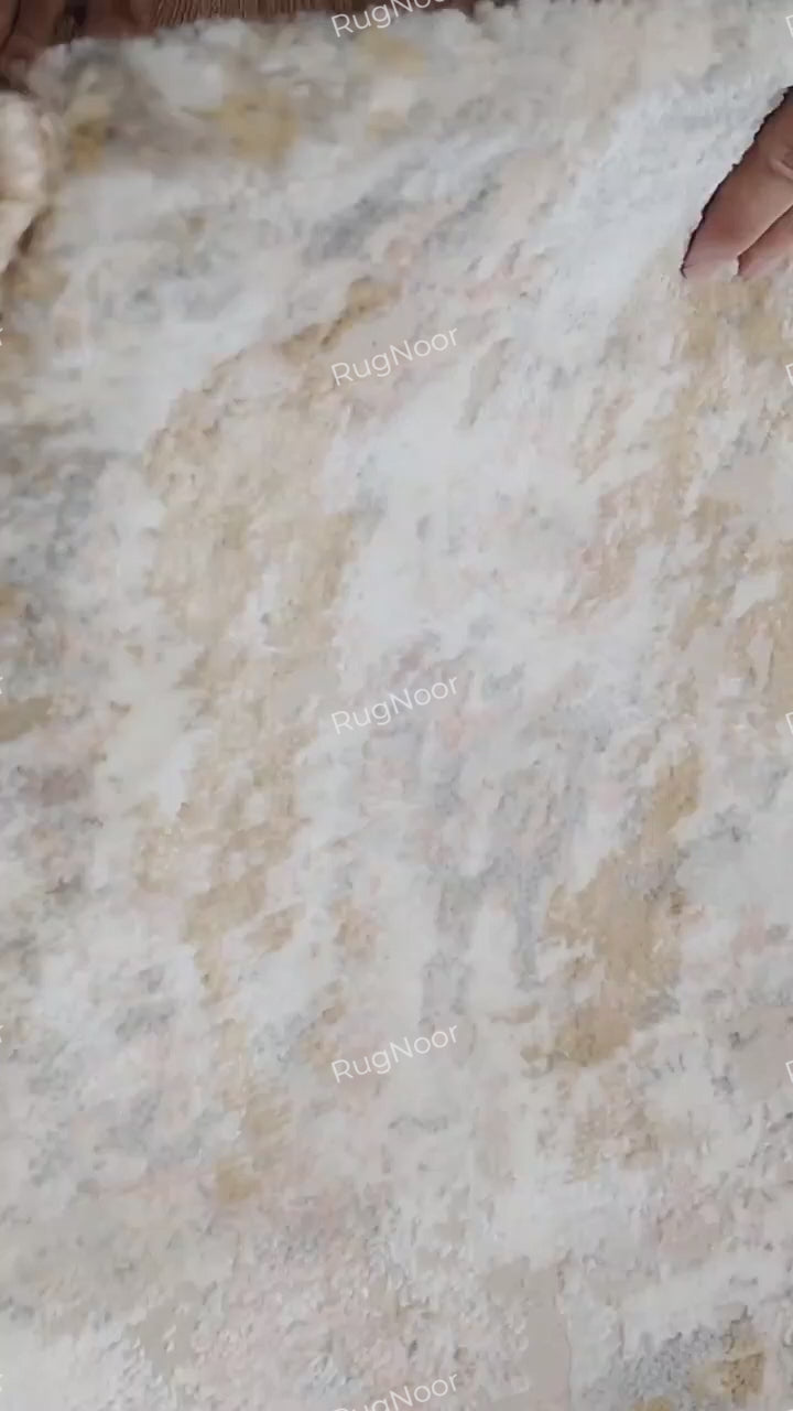 Video showing the underside and backing construction of the Crossfade modern abstract rug.