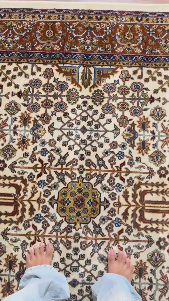 Close-up of intricate floral and vine motifs on the ivory field of Ghazal rug - RugNoor