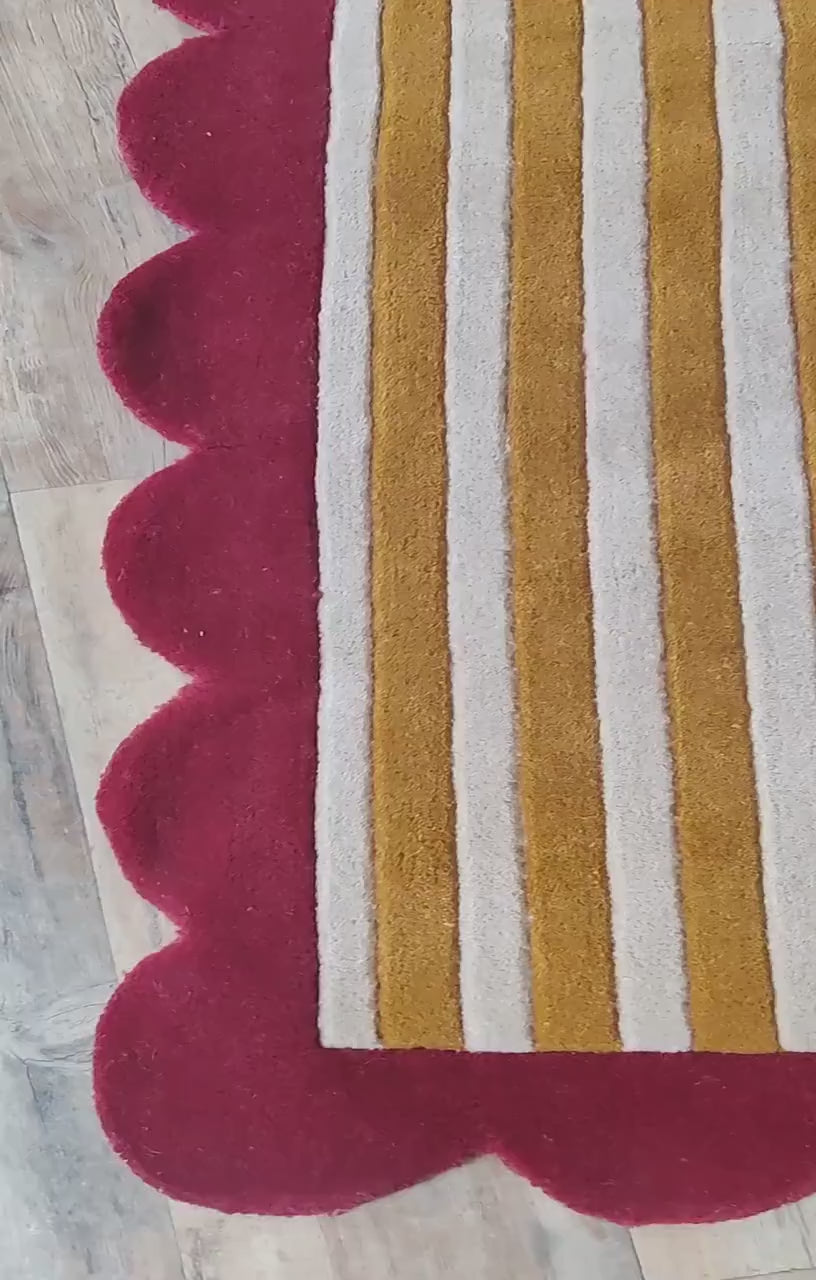scalloped carpet rug in mustard stripes