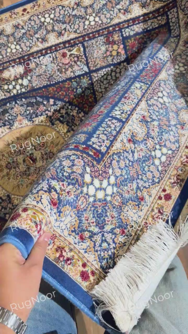 Detailed view of Nayrizan's floral medallion with ivory, gold, blue, and rust accents.