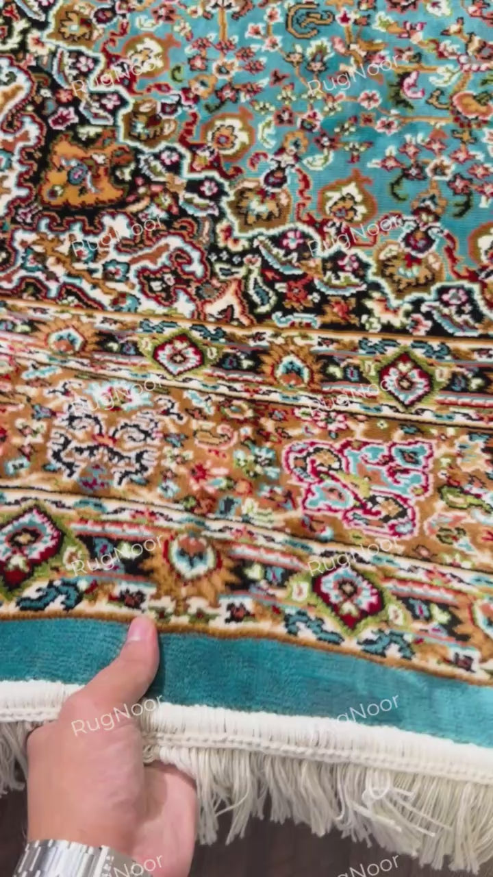 Close-up of ivory fringe and turquoise binding on the edge of the traditional rug - Zukhruf RugNoor