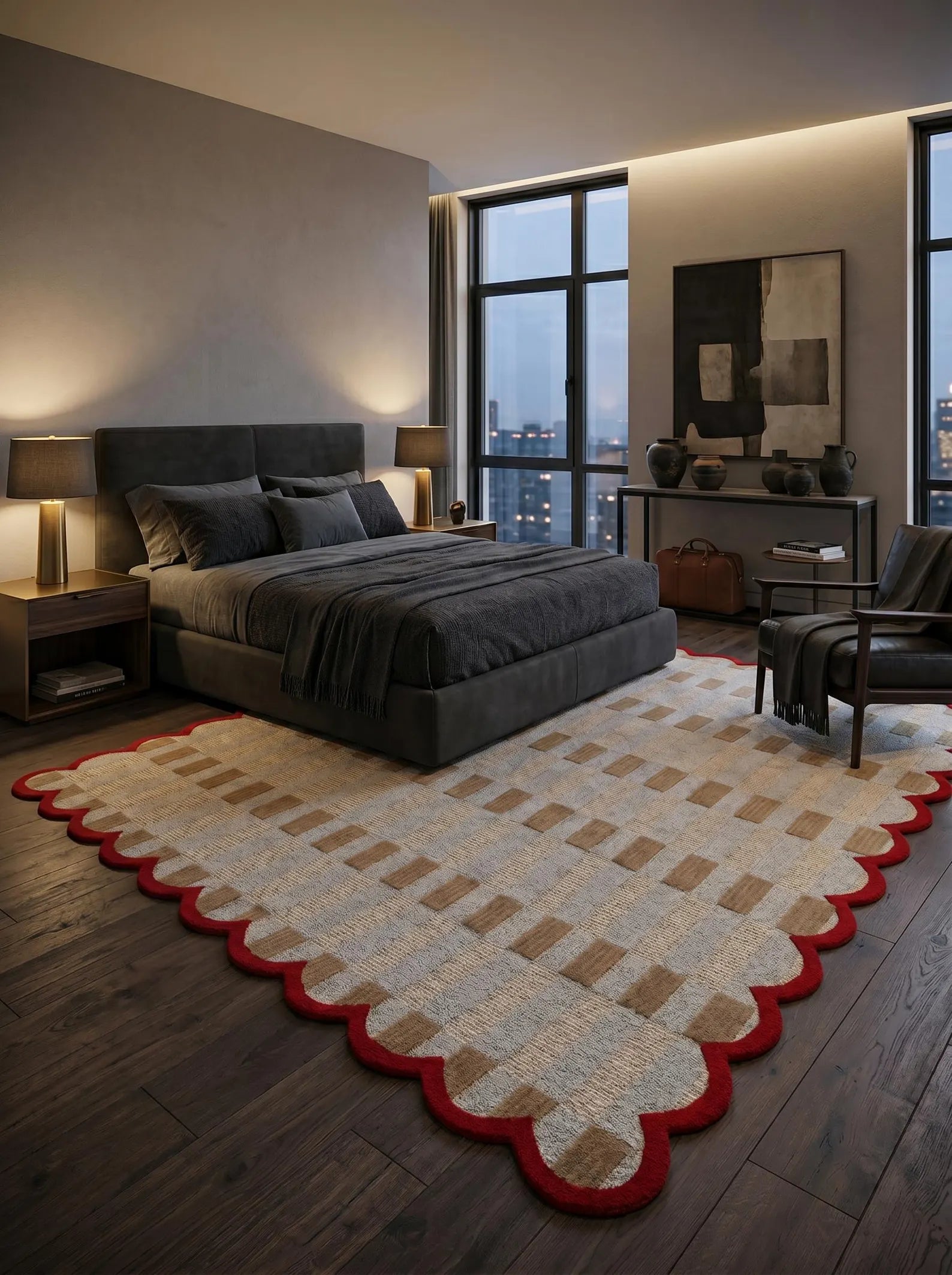 A modern bedroom featuring a large patterned area rug with a scalloped red border, styled in a contemporary dark-toned bedroom setting.