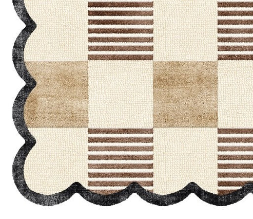 Close-up of scalloped black border on ivory and brown checkerboard hand-tufted wool rug, RugNoor