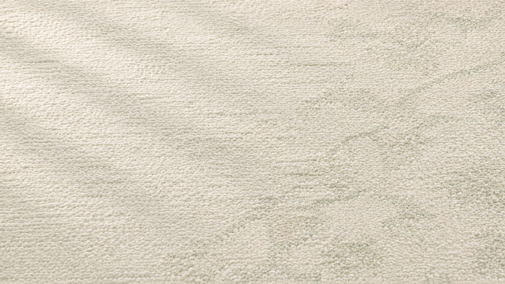 Close-up of woven cream wool rug texture with sage green stripe