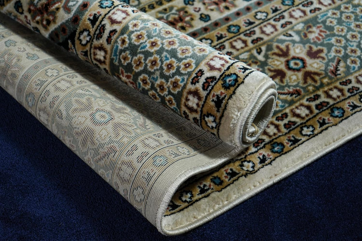 Safir Royal Medallion Rug folded to show the durable backing and finished edge