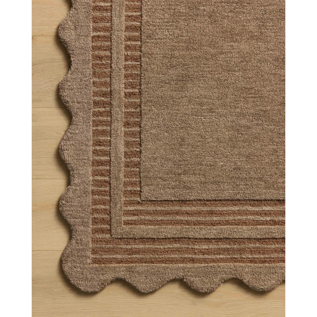 Brown textured rug on a wooden floor