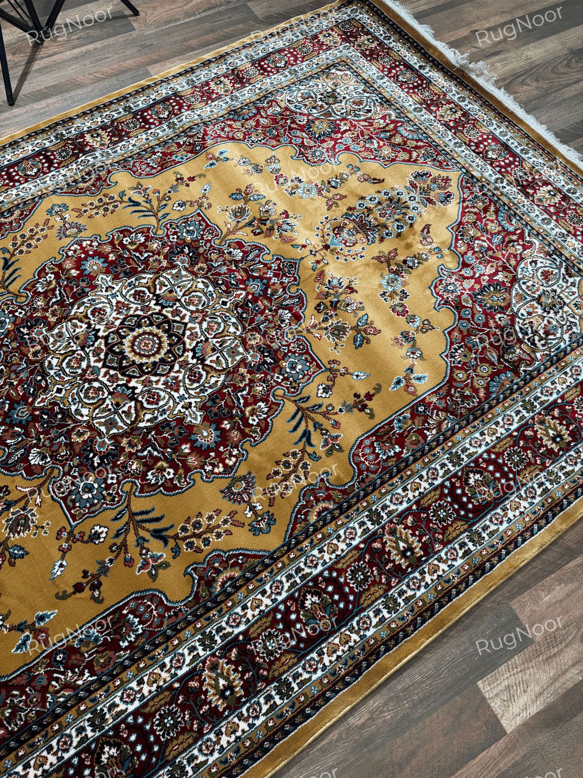 Full angled view of mustard gold rug with ornate floral medallion and multicolour borders - Shams RugNoor