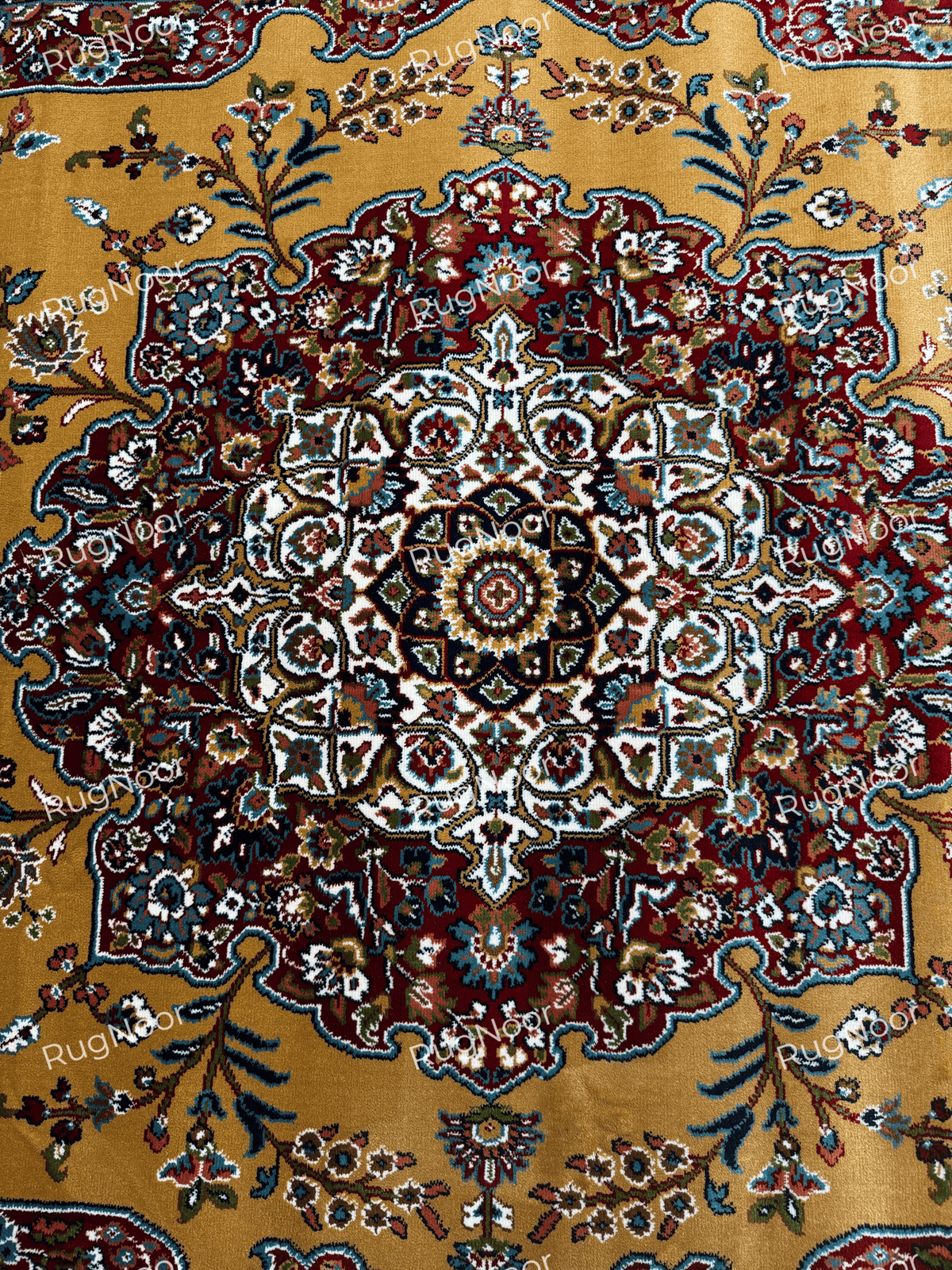 Close-up of the rug's intricate central medallion with cream, burgundy, navy and gold details - Shams RugNoor