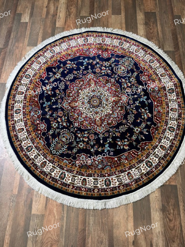 Tiraj round navy traditional floral rug with an ornate ivory central medallion, multicolour details, decorative borders, and fringe - RugNoor