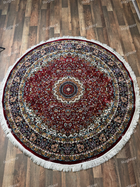Round burgundy traditional rug with an ornate central medallion, multicolour floral borders and ivory fringe - Yaqut RugNoor