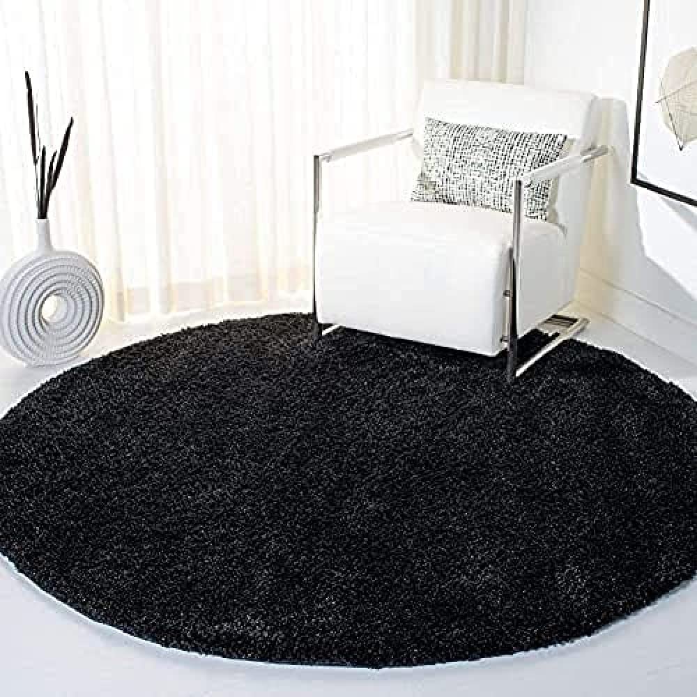 black shaggy round carpet placed in a living room - RugNoor