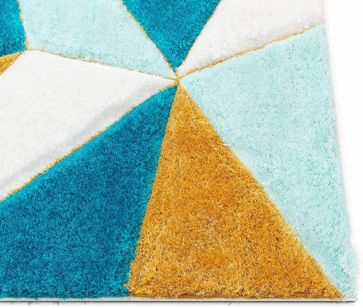 Close-up angle of RugNoor's blue and yellow geometric shag carpet texture