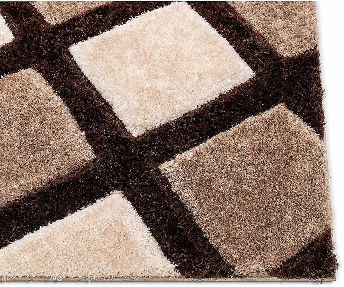 Close-up of RugNoor's crisscross brown and cream shag carpet design