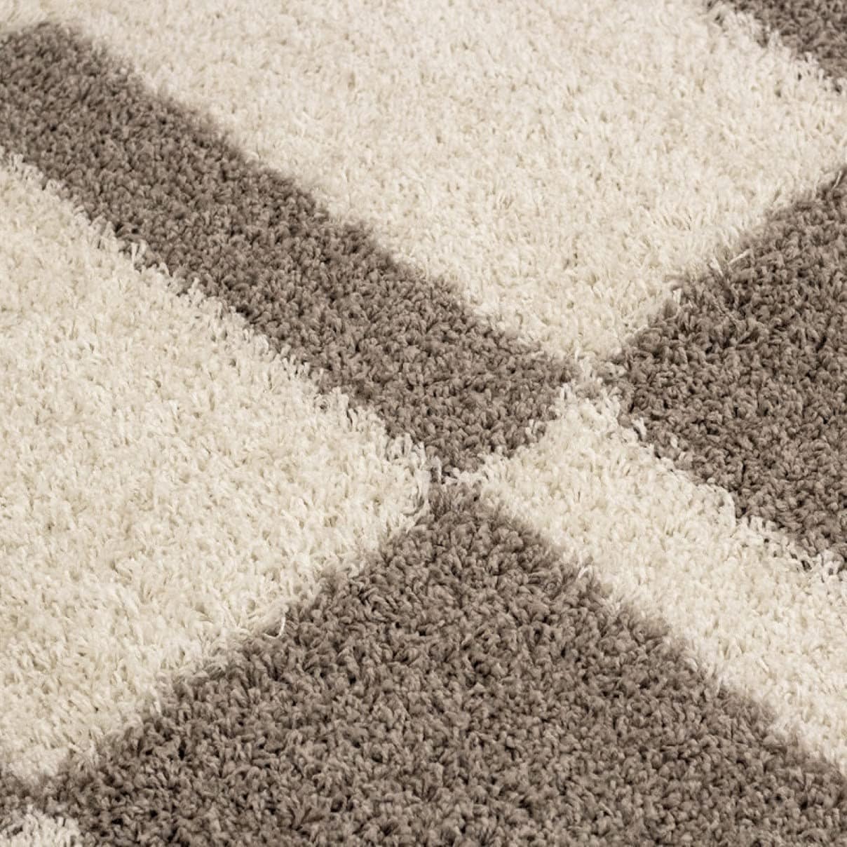 Top-down view of RugNoor's crosshatch carpet in white and brown tones