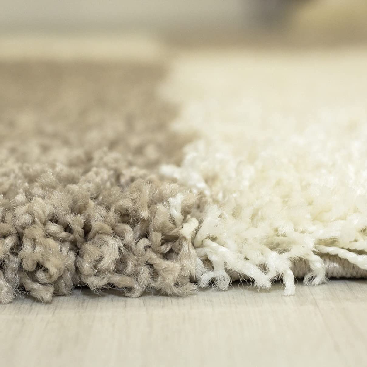 Textured close-up of RugNoor's white carpet showing coiled yarn detail