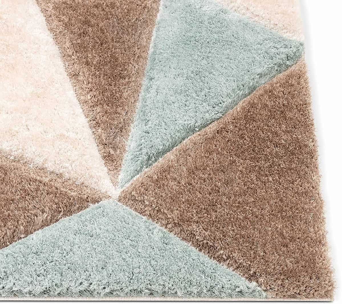 Close-up corner shot of RugNoor's triangle pattern shag carpet in teal and brown